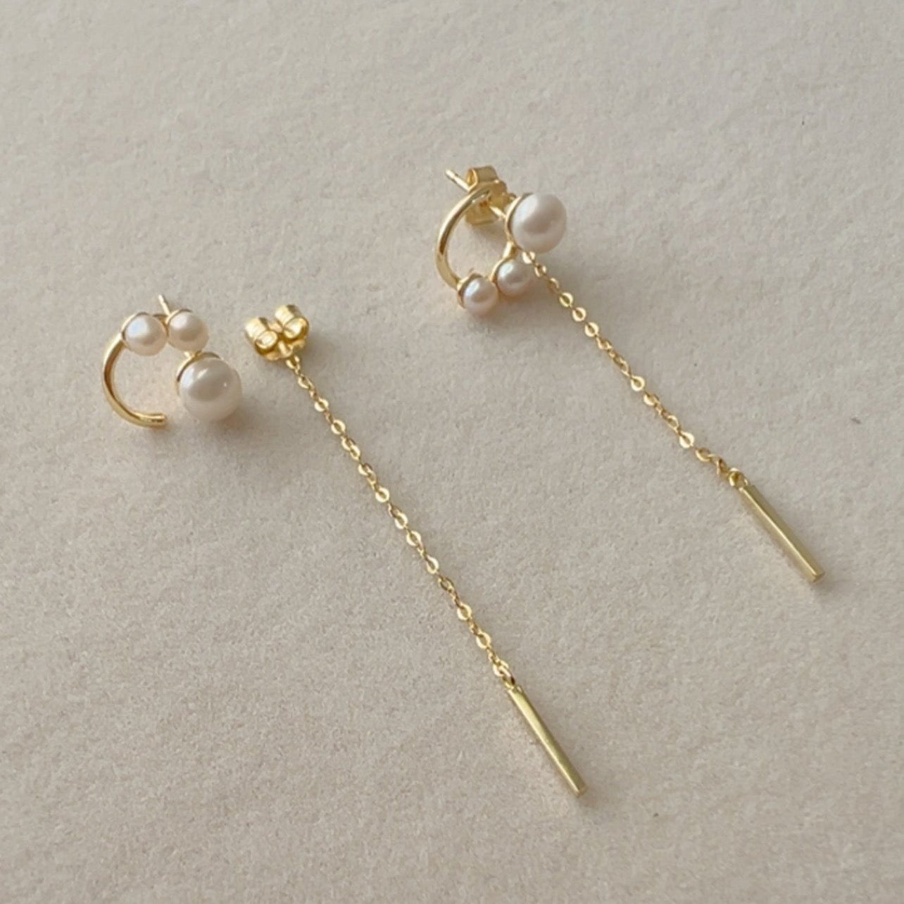 Gold chain dangle earrings with triple pearl
