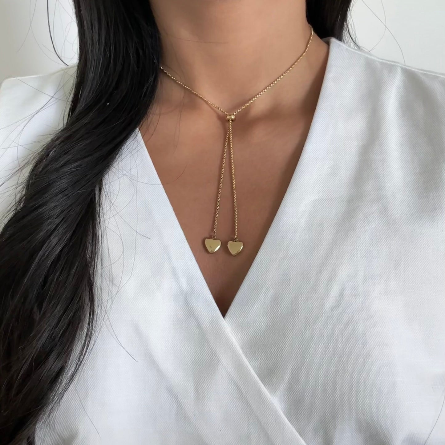 Gold necklace with two sliding hearts – Aria by Glow Amore