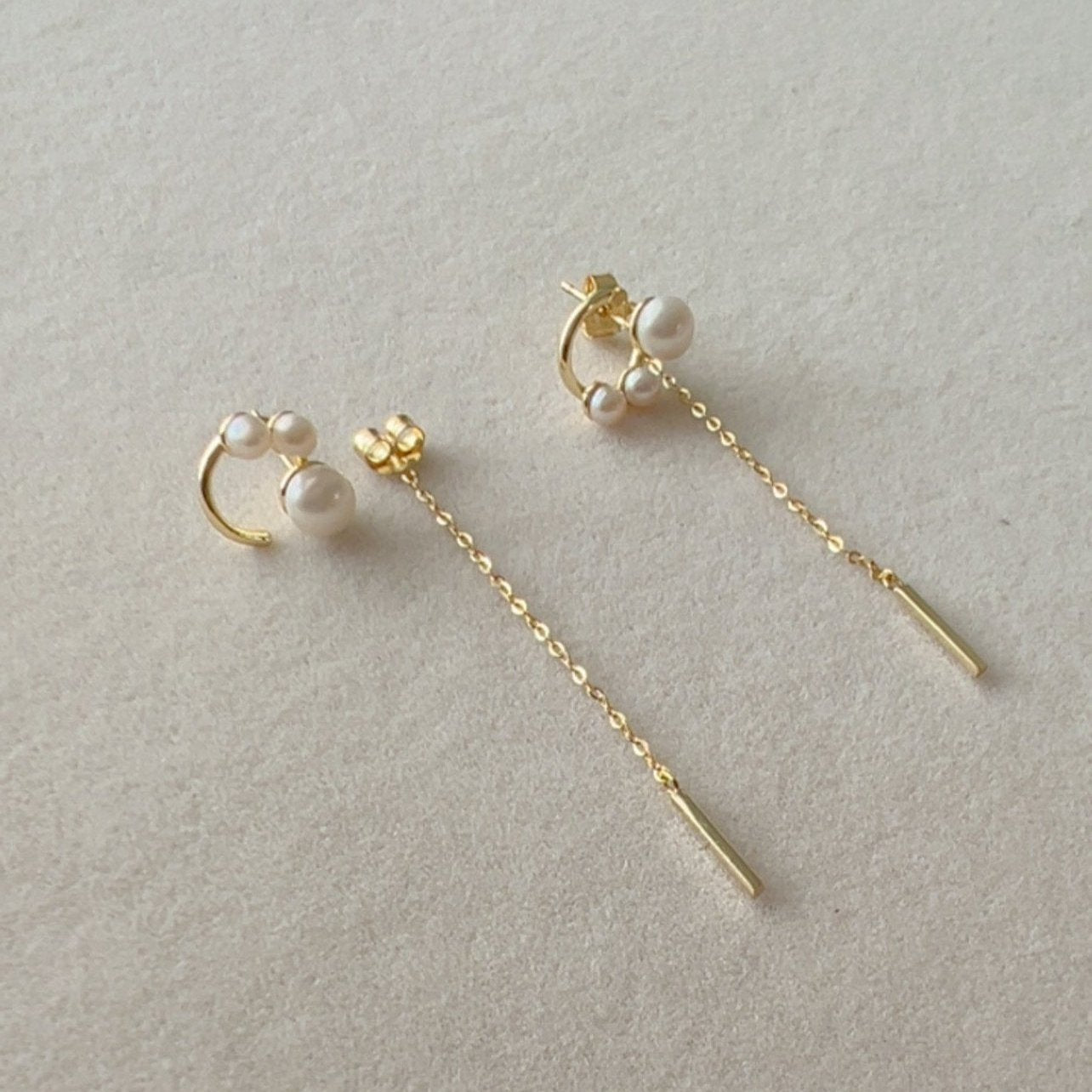 Gold chain dangle earrings with triple pearl