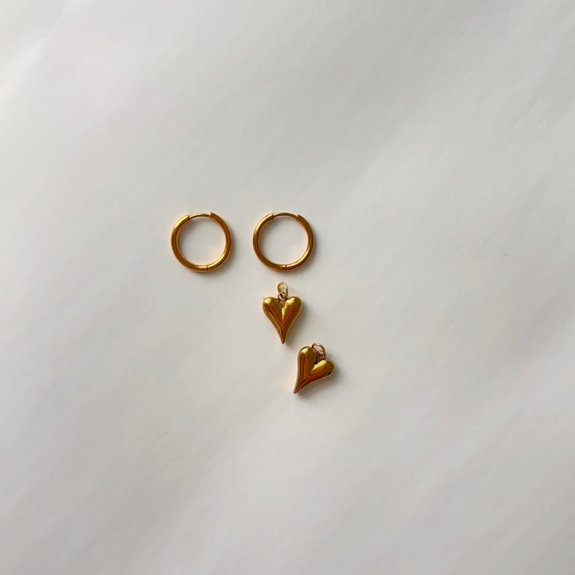 Model wearing Stella earrings – versatile gold hoops for daily wear

