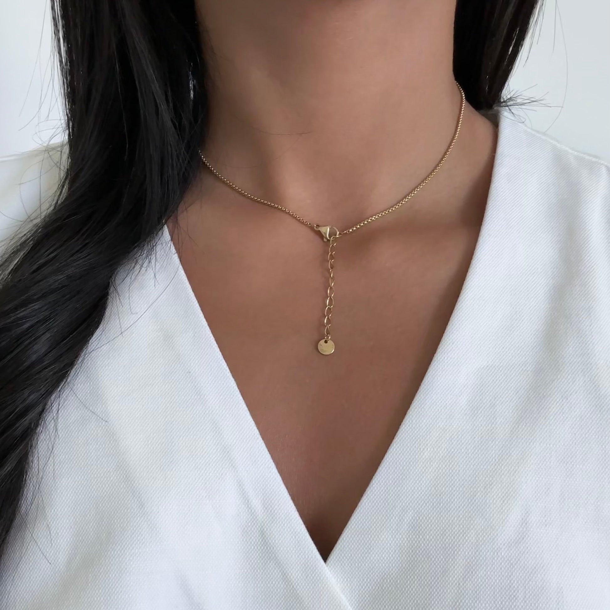 Model wearing Aria necklace – chic gold heart layering piece